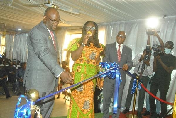 Ms Gifty Twum Ampofo (middle) with Dr. Wilfred Anim-Odame (right) and prof Amevi Acakpovi about to cut the tape