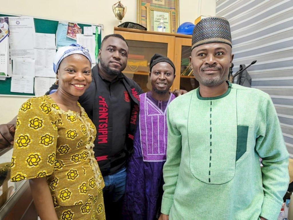 Mr  Salif(right)  and other staff of the Public Relations Unit