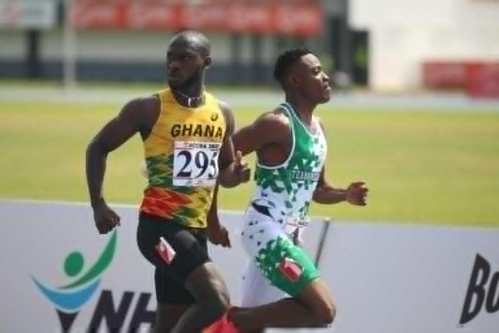 Benjamin Azamati races to the finish line with his Nigerian opponent in one of the 100m heats