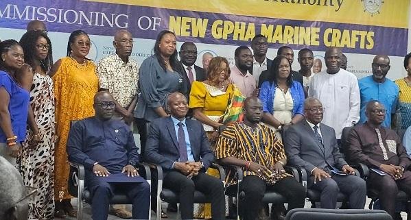 • A group picture of the retired personnel and their families and some dignitaries
