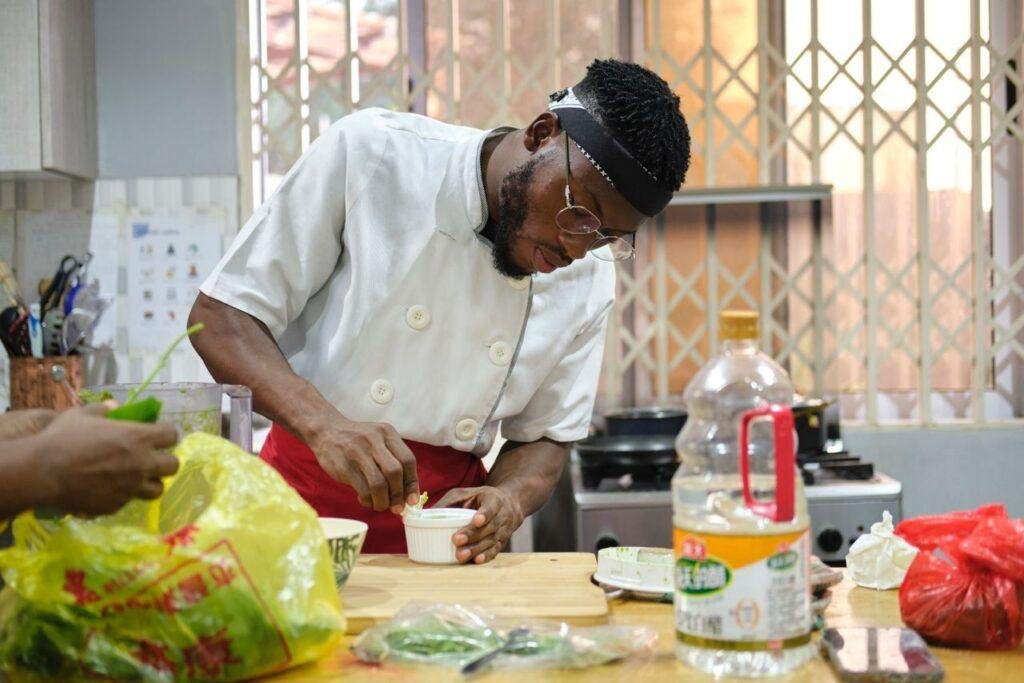 • Bismark showcasing his culinary skills