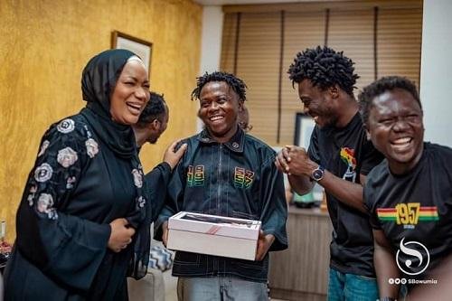 • Second Lady Mrs Bawumia (left) interacting with Kyekyeku (second left) and his team