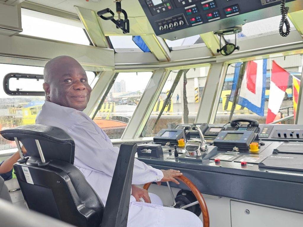 Mr. Adorkor having a feel of the marine craft named after him.