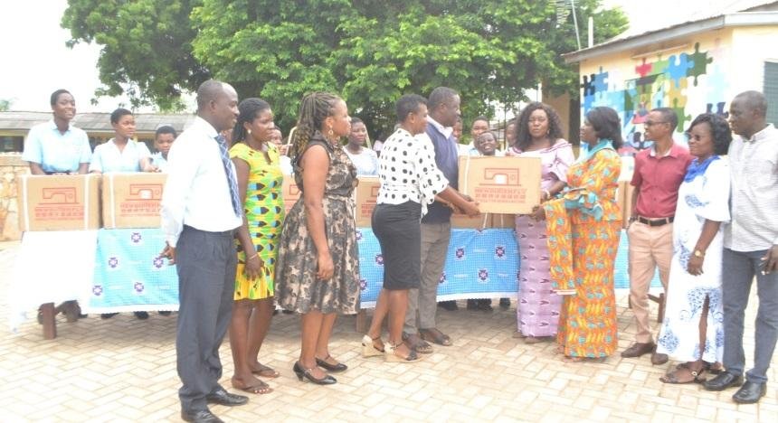 Ms. Sowah (fifth from right) presenting the machines to Mrs. Habiba Kotomah (fourth from right). With them are Mrs Narloni (fourth from left), teachers and some students of the school Photo: Victor A. Buxton
