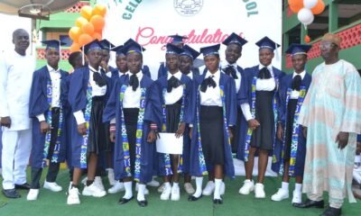 • Mr Amago (left) with Mr Siedu (right) and the graduands Photo: Victor A. Buxton.