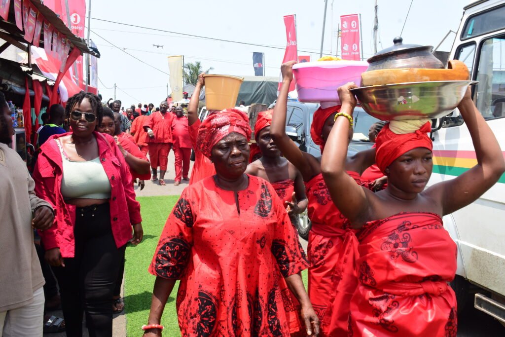Some of the  maidens carrying  pots of palmnut soup and Kpokpoi