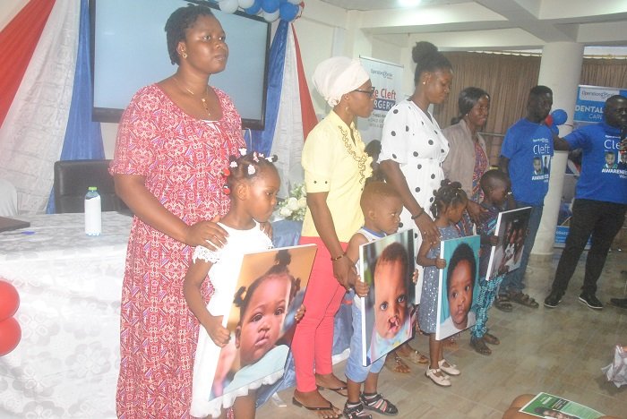 • Some of the parents with their children cured of cleft condition