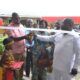 Mr Nikoi (second right) being assisted by (Mrs. Kotomah (middle) to cut the tape for the commissioning of the building programme Photo Victor A. Buxton