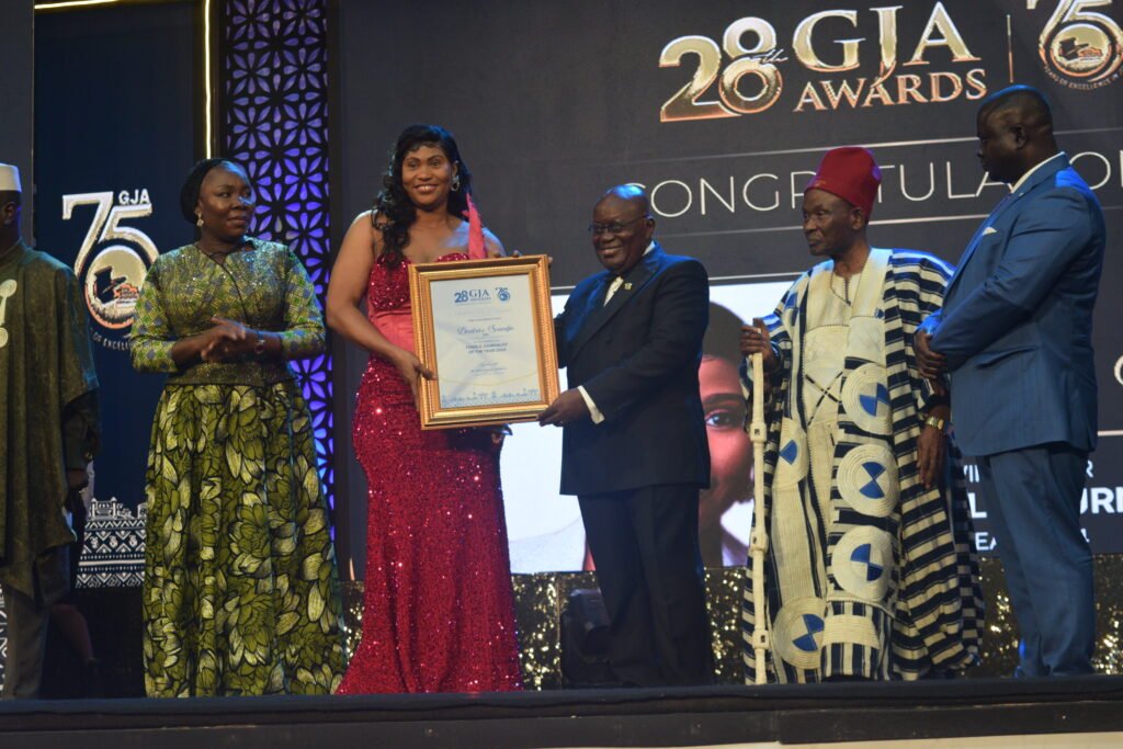 •President Akufo-Addo presenting an award to
female journalist of the year , Beatrice Senadju