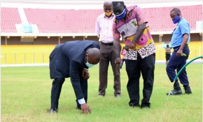 Some officials inspecting the Accra Stadium pitch