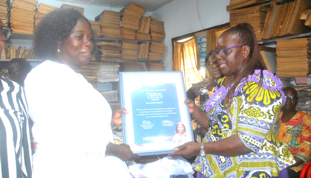•Mrs. Naomi Nartey receiving a citation from Mrs Georgina Quaittoo.