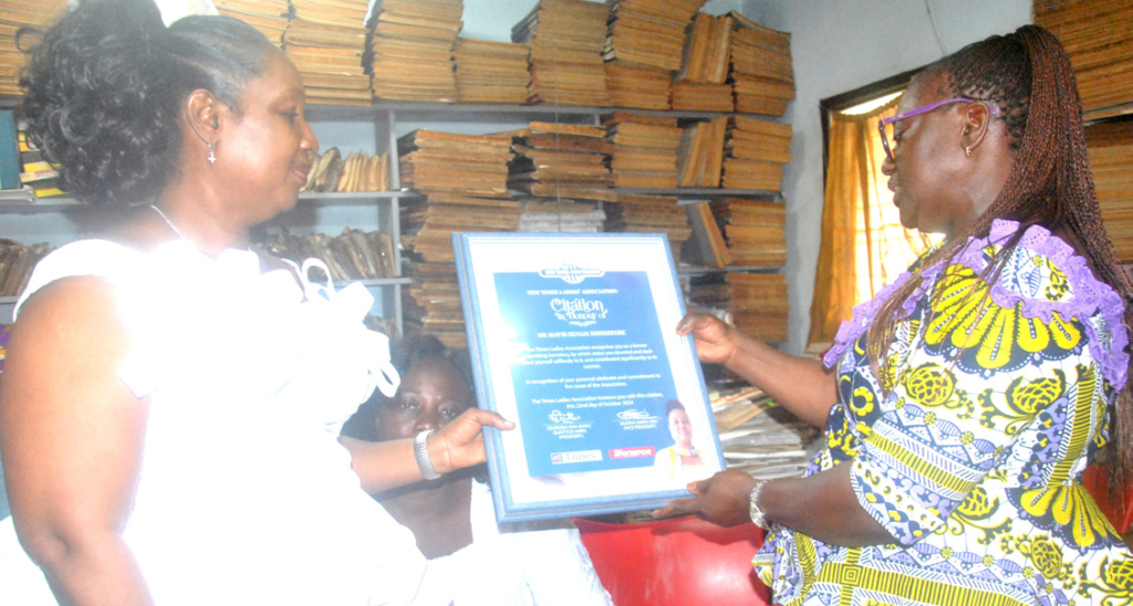 •Mrs Georgina Quaittoo [right] presenting a citation to Ms Mavis