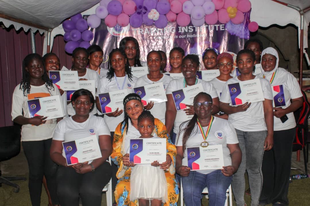•Mrs Ofori (seated, middle) with participants displaying their certificates. In front of her is El-Zoe Van-Dyck, a sixyear- old who also aquired the skills