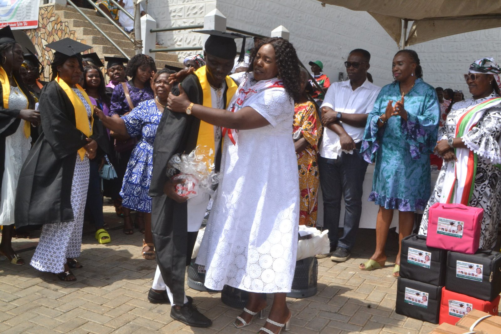 Ms. Sowah (right) congratulating one of the beneficiaries Photos Victor A. Buxton