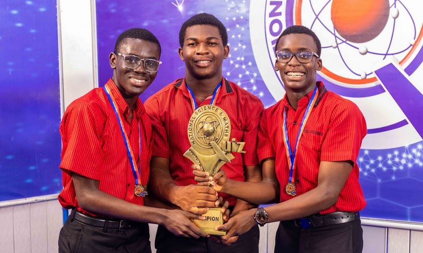 •The Mfantsipim winning trio with the 2024 NSMQ trophy