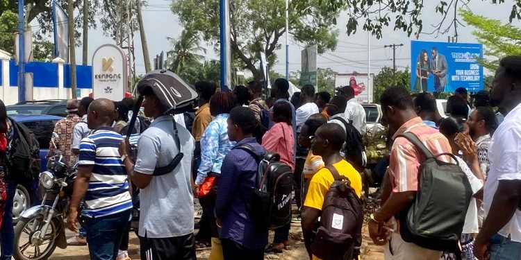 Some young men queing for visas