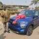 The philanthropist presenting a brand new car to Alhaji Yakubu Ayaana