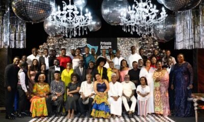 Welfare scheme actors pose for the camera
