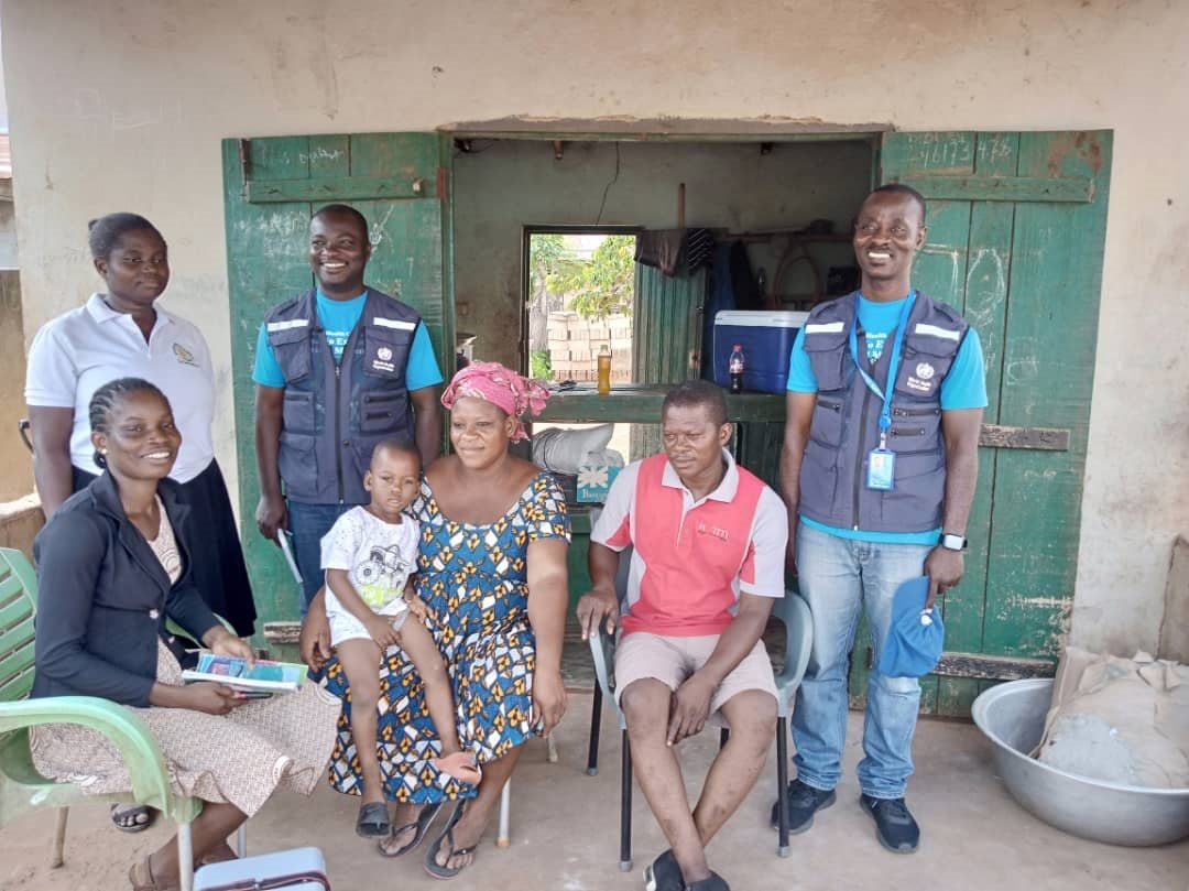 A group picture of the team and the family after successful vaccination