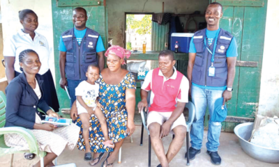 • A group picture of the team and the family after successful vaccination