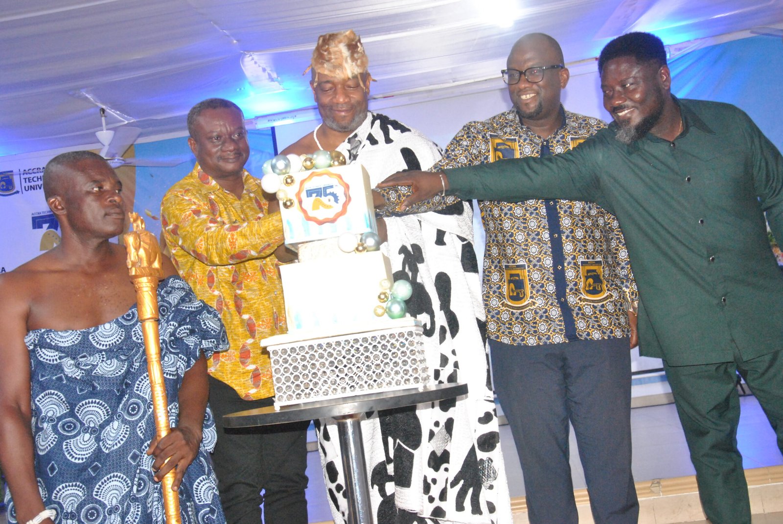 • The Ga Mantse Tackie Teiko Tsuru II [Middle] cutting the Anniversary Cake being assisted by Dr Samuel Bassah Quansah [right] Prof Amevi Acakpovi [2nd from right] and others Photo Lizzy Okai.