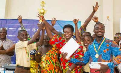 The Winner display a trophy