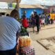 A section of the children lines up to get their meals