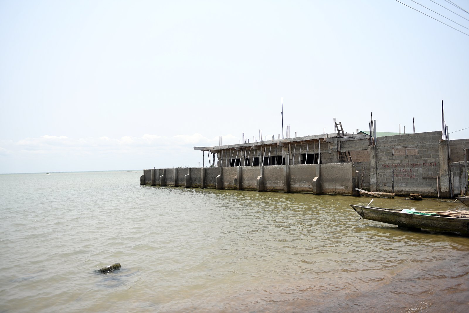 Fragments of a once inhabited home now lie submerged, swallowed by the encroaching waters along Keta’s coast(1)