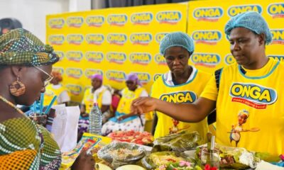 • One of the judges inspecting food cooked by participants