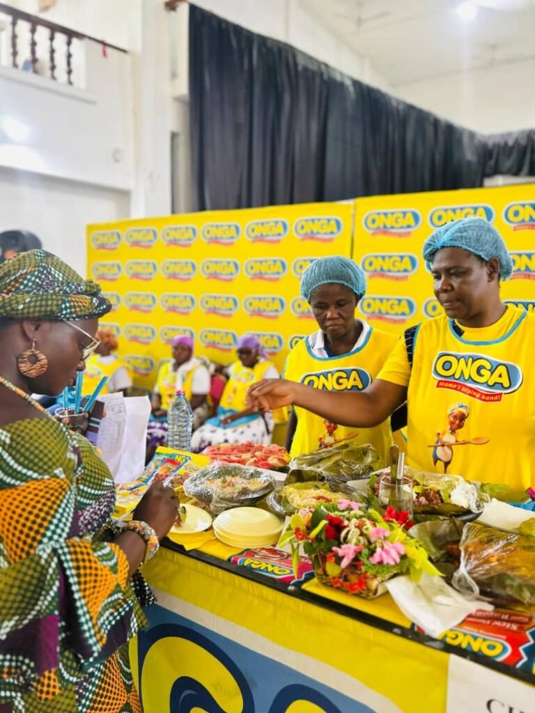 • One of the judges inspecting food cooked by participants