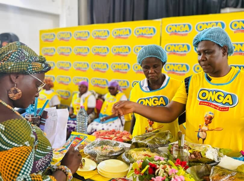 • One of the judges inspecting food cooked by participants