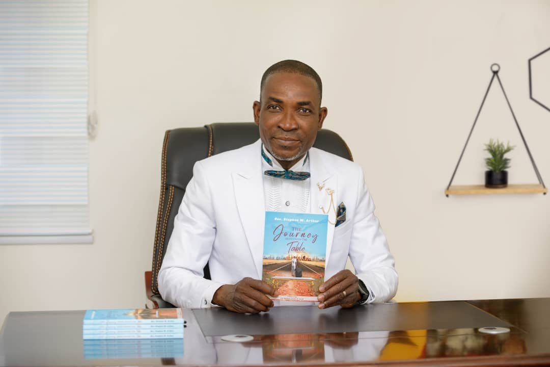 Rev. Stephen Arthur showcasing his book ‘The Journey From Under the Table’