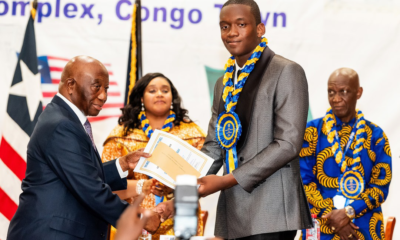 • President Bokai, Sr, presenting the overall best student award to David Ankrah of Hope College