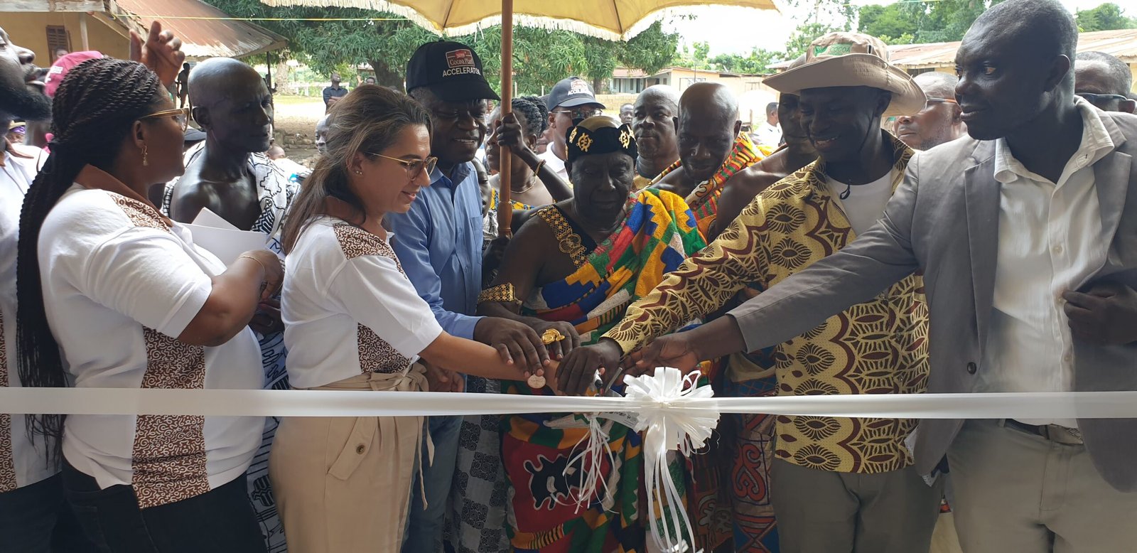 • A chief and some dignitaries cutting the tape