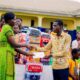 Mr Ansong (right) presenting the items to Madam Ahama (left)