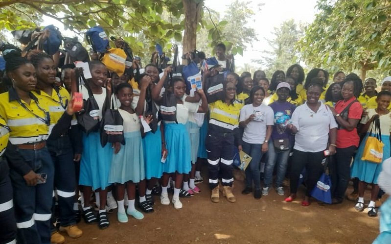 Mr Buta presenting a camera to one of the beneficiary schools