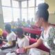 •A health practitioner giving out sanitary pad to the pupils