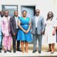 • Ms. Esther Kumi (Fifth from right) with Mr. Martin Adu-Owusu [fourth from right) Staff from NIB and NTC Management after the meeting Photo: Okai Elizabeth