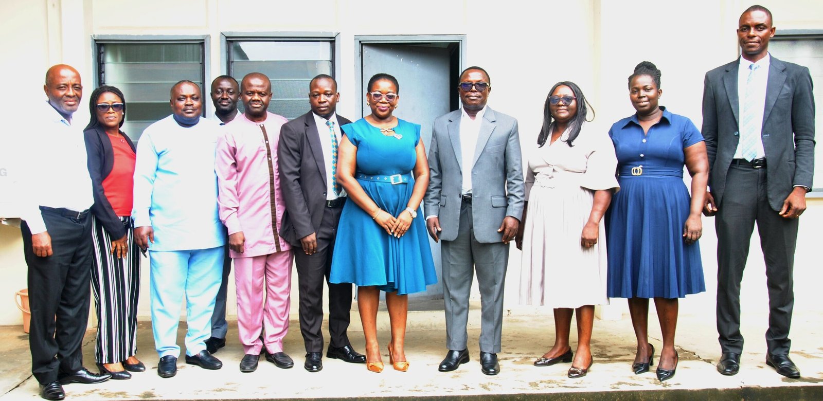 • Ms. Esther Kumi (Fifth from right) with Mr. Martin Adu-Owusu [fourth from right) Staff from NIB and NTC Management after the meeting Photo: Okai Elizabeth