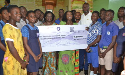 Ms Sowah (middle) handing over a dummy cheque to Mrs Kotomah (thrid from left). With them is Mr Alfredos Nii Anyetei (third from right) Photo: Victor A. Buxton