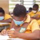 • Some school children taking their BECE exams