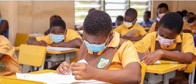 • Some school children taking their BECE exams