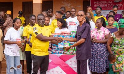 • Manager of Terry Yegbe, Eric Ahiabu (left) presenting sanitary products to a representative of Horti Primary School