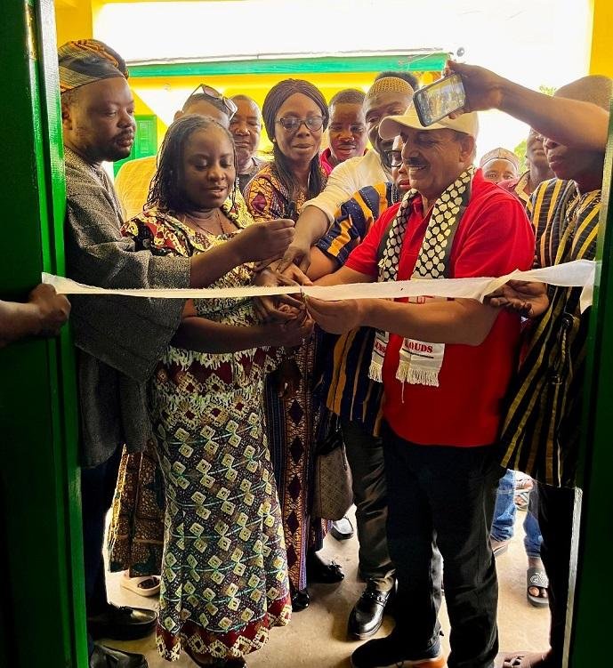 Abdalfatah Ahmed Khalil Alsatarri (second from right) cutting the ribbon with other dignitaries to commission the school.