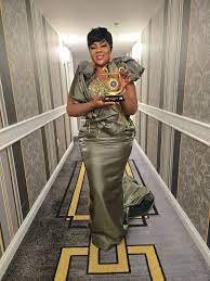 Empress Gifty showcasing her award