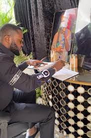• General manager of Despite groups , Kennedy Osei signing the book of condolence