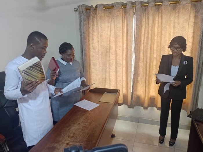 • Justice Janet Anima Maafo (right) swearing in the some of the new executives