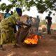 • A farmer going through the rudiment of extinguishing fire