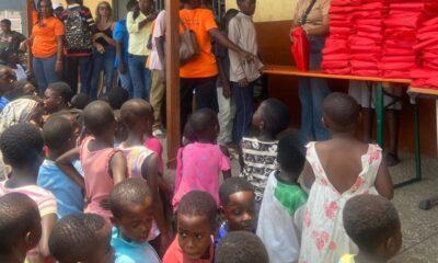 • A section of the children lines up to receive the books