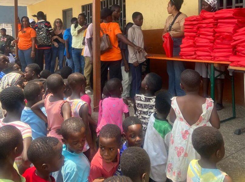 • A section of the children lines up to receive the books